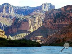 This Aug. 29, 2002 file photo, shows the Colorado River at the Grand Canyon National Park, in Arizona. A new report by a federal watchdog outlines a history of sexual harassment on river rafting trips run by Grand Canyon National Park. (AP Photo/Brian Witte, File)