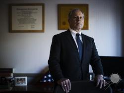 In this Monday, Dec. 19, 2016 photo, interim U.S. Attorney Bruce Brandler poses for a photograph at his office in Harrisburg, Pa. The top federal prosecutor for central and northeastern Pennsylvania announced a strategy to combat the heroin and prescription painkiller epidemic. What few people know is that Brandler, a veteran prosecutor recently named interim U.S. attorney, lost his own son to a heroin overdose. (AP Photo/Matt Rourke)