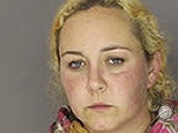 In this undated photo provided by the Chester County, Pa., District Attorney's Office, Jessica Lynn Riffey is seen. Prosecutors say the 34-year-old woman from West Caln Township supplied a 14-year-old girl and a 16-year-old boy with heroin, tied a string around their arms to isolate veins and injected them on multiple occasions last month. (Chester County, Pa., District Attorney's Office via AP)