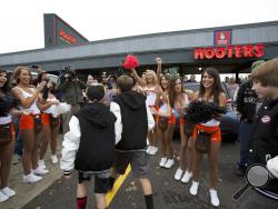 The Corbett football team arrives at Hooters on Hayden Island for their team party Saturday Nov. 9, 2013, in Portland, Ore. (AP Photo/The Oregonian, Michael Lloyd)