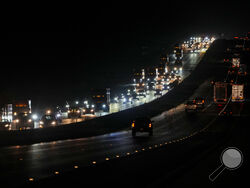 Heavy traffic flows northbound on Interstate-75 as people evacuate the Tampa Bay area ahead of Hurricane Milton's arrival late Monday, Oct. 7, 2024, in Ocala, Fla. (AP Photo/Julio Cortez)