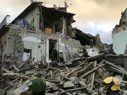 This still image taken from video shows rescuers searching a collapsed building in Amatrice, central Italy, where a 6.1 earthquake struck just after 3:30 a.m., Wednesday, Aug. 24, 2016. The quake was felt across a broad section of central Italy, including the capital Rome where people in homes in the historic center felt a long swaying followed by aftershocks. (AP Photo)