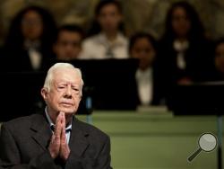 In a Sunday, Aug. 23, 2015 file photo, former President Jimmy Carter teaches Sunday School class at Maranatha Baptist Church in his hometown, in Plains, Ga. Former President Carter said Sunday, Dec. 6, 2015, that no cancer was detected in his latest scan. (AP Photo/David Goldman, File)