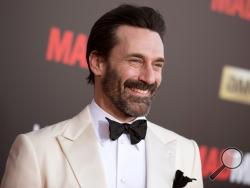 In this March 25, 2015 file photo, Jon Hamm arrives at The Black And Red Ball In Celebration Of The Final Seven Episodes Of "Mad Men" in Los Angeles. Court records show “Mad Men” star Jon Hamm was accused of helping lead a violent 1990 fraternity hazing at the University of Texas. (AP Photo/Photo by Richard Shotwell/Invision/AP, File)
