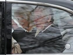 King Charles III waves as he and Queen Camilla leave Clarence House by car in London, Tuesday, Feb. 6, 2024. Buckingham Palace announced Monday evening that the king has begun outpatient treatment for an undisclosed form of cancer. (AP Photo/Frank Augstein)