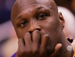 In this April 24, 2007, file photo, Los Angeles Lakers' Lamar Odom sits on the bench in the fourth quarter of a Western Conference playoff basketball game against the Phoenix Suns in Phoenix.(AP Photo/Ross D. Franklin, File)