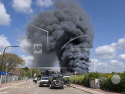 Smoke rises from a fire after rockets fired from Lebanon struck Bezet, northern Israel, Thursday, April 6, 2023. Militants in Lebanon have fired a heavy barrage of rockets at Israel, the Israeli military said, forcing people across Israel's northern frontier into bomb shelters, wounding at least two people and ratcheting up regional tensions a day after Israeli police raided Jerusalem's most sensitive holy site. (AP Photo/Fadi Amun)