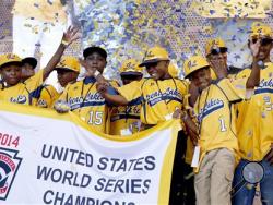 Members of the Jackie Robinson West Little League baseball team participate in a rally celebrating the team's U.S. Championship. The league stripped the team of its title after finding the Chicago team falsified its boundary map and placed players on the team who didn’t qualify. The leaguel also suspended Jackie Robinson West manager Darold Butler from league activity. (AP Photo/Charles Rex Arbogast, File)