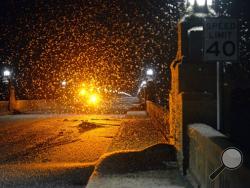 A swarm of mayflies hovers over the Route 462 bridge over the Susquehanna River late Saturday evening, June 13, 2015, between Columbia and Wrightsville, Pa. (Blaine Shahan/LNP via AP)