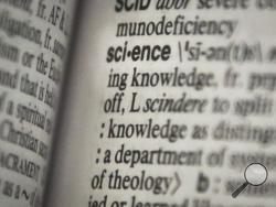 This Monday, Dec. 2, 2013 photo shows the word "science" on a page of a Merriam-Webster dictionary, in New York. "Science" is the publisher's word of the year. (AP Photo/Bebeto Matthews)