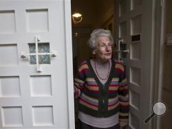 In this Wednesday, Jan. 20, 2016, photo, Dutch Israeli holocaust survivor Mirjam Bolle is seen in her house in Jerusalem. (AP Photo/Sebastian Scheiner)