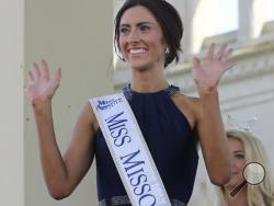 In this Tuesday, Aug. 30, 2016 file photo, Miss Missouri, Erin O'Flaherty waves as she is introduced during Miss America Pageant arrival ceremonies in Atlantic City. After competing in pageants for generations in the closet or working behind the scenes, gays and lesbians finally get to see one of their own take one of pageantry's biggest stages. O' Flaherty, will compete for the Miss America crown on Sept. 11, as the first openly lesbian contestant. (AP Photo/Mel Evans, File)