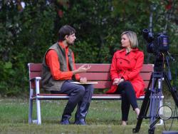 Nathan Carman, rescued from a life raft after a fishing trip, talks to an ABC news reporter in Brattleboro, Vt., Wednesday, Sept. 28, 2016. Carman, a 22-year-old man rescued from a life raft after a fishing trip that left his mother missing and presumed dead, had been a suspect in the still-unsolved 2013 slaying of his rich grandfather, adding to the multitude of questions swirling around him and what happened at sea. (Kristopher Radder/The Brattleboro Reformer via AP)