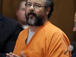 In this Aug. 1, 2013, file photo, Ariel Castro makes a statement in the courtroom during his sentencing for kidnapping three women in Cleveland. A report from the Ohio Department of Rehabilitation and Correction said two prison guards falsified logs documenting their observation of Castro in the hours before he hanged himself in his cell Sept. 3, 2013, at a prison reception center south of Columbus. (AP Photo/Tony Dejak, File)