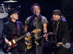 In this March 15, 2016 file photo, Bruce Springsteen, center, performs with Nils Lofgren, left, and Steven Van Zandt of the E Street Band during their concert in Los Angeles. (Photo by Chris Pizzello/Invision/AP, File)