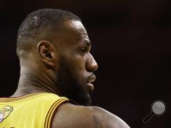 Blood shows on the head Cleveland Cavaliers forward LeBron James (23) during the second half of Game 4 of basketball's NBA Finals against the Golden State Warriors in Cleveland, Thursday, June 11, 2015. (AP Photo/Tony Dejak)