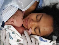 This Sept. 4, 2016 photo provided by Ryan Grassley shows Lidia Grassley and her son Samuel at Utah Valley Hospital in Provo, Utah. (Ryan Grassley via AP)