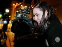 Jordan Graham leaves the Federal Courthouse in Missoula, Mont., Monday, Dec. 9, 2013 after the first day of her murder trial. Graham, 22, is accused of murdering Cody Johnson, her husband of eight days, by pushing him off a cliff in Glacier National Park on July 7. (AP Photo/Missoulian, Kurt Wilson)