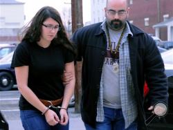 Miranda Barbour is brought into a district judge's office in December in this file photo. (AP Photo/The News-Item, Mike Staugaitis, File)