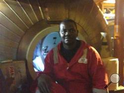 In this image made available Tuesday Dec. 3, 2013, Harrison Odjegba Okene poses for a portrait inside a decompression chamber after being rescued from three days underwater. (AP Photo)