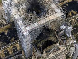 An image made available by Gigarama.ru on Wednesday April 17, 2019 shows an aerial shot of the fire damage to Notre Dame cathedral in Paris on Tuesday April 16. Nearly $1 billion has already poured in from ordinary worshippers and high-powered magnates around the world to restore Notre Dame Cathedral in Paris after it was damaged in a massive fire on Monday. (Gigarama.ru via AP)