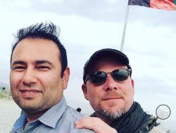 This undated photo provided by NPR shows Zabihullah Tamanna, left, and David Gilkey. Gilkey, a veteran news photographer and video editor for National Public Radio, and Tamanna, an Afghan translator, were killed while on assignment in southern Afghanistan on Sunday, June 5, 2016, a network spokeswoman said. (Monika Evstatieva/NPR via AP) 