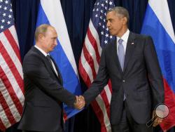 FILE - In this Sept. 28, 2015 file photo, President Barack Obama shakes hands with Russian President President Vladimir Putin before a bilateral meeting at United Nations headquarters. Obama has ordered intelligence officials to conduct a broad review on the election-season hacking that rattled the presidential campaign and raised new concerns about foreign meddling in U.S. elections, a White House official said Friday. White House counterterrorism and Homeland Security adviser Lisa Monaco said Obama ordere