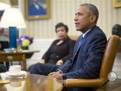 Attorney General Loretta Lynch listens as President Barack Obama speaks in the Oval Office of the White House in Washington, Monday, Jan. 4, 2016, during a meeting with law enforcement officials to discuss executive actions the president can take to curb gun violence. (AP Photo/Pablo Martinez Monsivais)