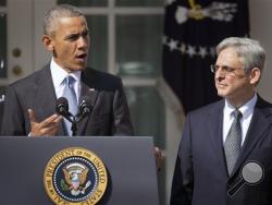 Federal appeals court judge Merrick Garland, right, stands with President Barack Obama as he is introduced as Obama's nominee for the Supreme Court during an announcement in the Rose Garden of the White House, in Washington, Wednesday, March 16, 2016. (AP Photo/Pablo Martinez Monsivais)