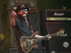 This June 26, 2015 file photo shows Motorhead bassist Lemmy Kilmister performing on the Pyramid stage during Glastonbury Music Festival at Worthy Farm, Glastonbury, England. Ian "Lemmy" Kilmister, the Motorhead frontman whose outsized persona made him a hero for generations of hard-rockers and metal-heads, has died on Monday, Dec. 28, 2015. (Photo by Joel Ryan/Invision/AP, file)