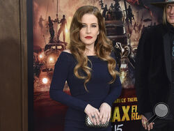 FILE - Lisa Marie Presley arrives at the Los Angeles premiere of "Mad Max: Fury Road" at the TCL Chinese Theatre on May 7, 2015. Presley, singer and only child of Elvis, died Thursday, Jan. 12, 2023, after a hospitalization, according to her mother, Priscilla Presley. She was 54. (Photo by Jordan Strauss/Invision/AP, File)