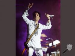 In this April 26, 2008 file photo, Prince performs during the second day of the Coachella Valley Music and Arts Festival in Indio, Calif. Prince's publicist has confirmed that Prince died at his home in Minnesota, Thursday, April 21, 2016. He was 57. (AP Photo/Chris Pizzello, File)