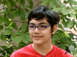 In this recent but undated frame from video provided by KOVR-TV, Tanishq Abraham, 12, talks about his recent graduation from community college and beginning his university education this fall, in an interview at American River College in Sacramento, Calif. (KOVR-TV via AP) 