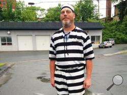 In this June 9, 2015 photo, James Lowe of Barnet, Vt., poses for a photo after a judge told him to leave the Caledonia County Courthouse in St. Johnsbury, Vt., for wearing prison stripes and matching beanie to jury selection. (Dana Gray/The Caledonian Record via AP)