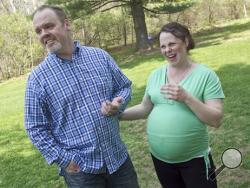 Kateri and Jay Schwandt stand outside their Rockford, Mich. home Wednesday, May 6, 2015. (Chris Clark/The Grand Rapids Press via AP)