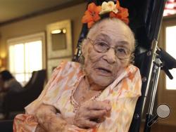 In this Thursday, July 3, 2014 photo, Gertrude Weaver poses at Silver Oaks Health and Rehabilitation Center in Camden, Ark., a day before her 116th birthday. The Gerontology Research Group says Weaver is the oldest person in the United States and second-oldest person in the world. (AP Photo/Danny Johnston)
