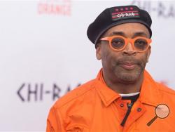 In a Tuesday, Dec. 1, 2015 file photo, Spike Lee attends the premiere of "Chi-Raq" at the Ziegfeld Theatre, in New York. Calls for a boycott of the Academy Awards are growing over the Oscars’ second straight year of mostly white nominees, as Spike Lee and Jada Pinkett Smith each said Monday, Jan. 17, 2016, that they will not attend this year’s ceremony. (Photo by Charles Sykes/Invision/AP, File)