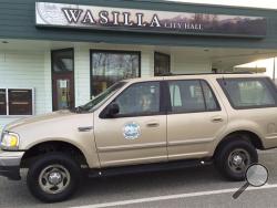 This Nov. 7, 2013 photo provided by The City of Wasilla (Alaska) Department of Public Works shows a cardboard cutout of Sarah Palin in the 1999 Ford Expedition she used when she was mayor of Wassila, outside City Hall in Wasilla, Alaska.