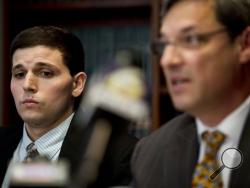 James Vivenzio, left, listens to his attorney Aaron J. Frewiald during news conference Monday, June 8, 2015, in Philadelphia. Vivenzio, a former student who blew the whistle on a Penn State fraternity's secret Facebook page featuring photos of naked women says the university ignored his complaints about sexual assault, hazing and drug use. (AP Photo/Matt Rourke)