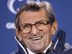 In this Oct. 29, 2011, file photo, Penn State head coach Joe Paterno smiles as he talks with reporters after recording his 409th career coaching victory, a 10-7 win over Illinois, during a a post-game NCAA college football news conference in State College, Pa. (AP Photo/Gene J. Puskar, File) 