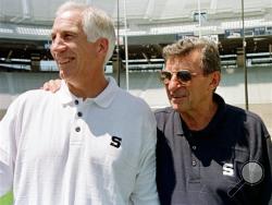In this Aug. 6, 1999, file photo, Penn State head football coach Joe Paterno, right, poses with his defensive coordinator Jerry Sandusky during Penn State Media Day at State College, Pa. (AP Photo/Paul Vathis, File)