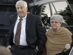 Jerry Sandusky arrives with his wife, Dottie Sandusky, for a preliminary hearing at the Centre County Courthouse in Bellefonte, Pa., where he faced his accusers. In an interview broadcast Wednesday, March 12, 2014 on NBC's "Today," Dottie Sandusky says she "definitely" believes her husband is innocent despite his conviction of the sexual abuse of 10 boys. Jerry Sandusky is serving a 30- to 60-year sentence. (AP Photo/Gene J. Puskar, File)