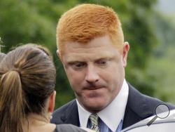 In this June 12, 2012, file photo, former Penn State University assistant football coach Mike McQueary arrives at the Centre County Courthouse in Bellefonte, Pa. McQueary's defamation and whistleblower lawsuit against Penn State over how it treated him for complaining about assistant football coach Jerry Sandusky sexually abusing a boy in a team shower is scheduled to go to trial Monday, Oct. 17, 2016, with opening statements in a courthouse near the university campus. (AP Photo/Gene J. Puskar, File)