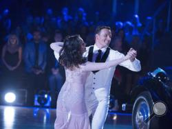 In this photo provided by ABC, Cheryl Burke, left, and Ryan Lochte, perform on "Dancing with the Stars," competition that begins with the two-hour season premiere live, Monday, Sept. 12, 2016, on the ABC Television Network. (Eric McCandless/ABC via AP)