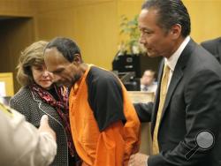 Francisco Sanchez, center, is lead out of the courtroom by San Francisco Public Defender Jeff Adachi, right, and Assistant District Attorney Diana Garciaor, left, after his arraignment at the Hall of Justice on Tuesday, July 7, 2015, in San Francisco. (Michael Macor/San Francisco Chronicle via AP, Pool)