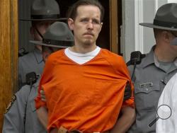 On Thursday, authorities added terrorism charges against Eric Frein and they say he told them he wanted to "wake people up." State police say Frein called slaying of Cpl. Bryon Dickson an "assassination" in an interview after his capture. (AP Photo/The Scranton Times-Tribune, Michael J. Mullen, File)