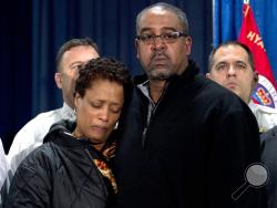 The parents of police officer Jacai Colson, James and Sheila Colson attend a news conference at Prince George's County Police headquarters Monday, March 14, 2016, in Hyattsville, Md. ( AP Photo/Jose Luis Magana)