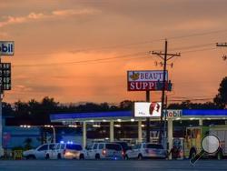  In this Sunday, July 17, 2016 file photo, Baton Rouge Police investigate the scene in Baton Rouge, La., where several law enforcement officers were killed and wounded. (Scott Clause/The Daily Advertiser via AP, File)