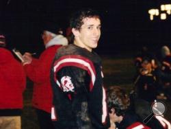 In this undated photo provided by Debra Pyka, Joseph Chernach stands on the sideline during a high school football game in Crystal Falls, Mich. (AP Photo/Debra Pyka)