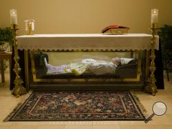 The remains of Saint John Neumann are shown Tuesday, May 5, 2015, at the national shrines of St. John Neumann in Philadelphia. (AP Photo/Matt Rourke)
